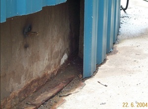 Example of a tank placed on an oversized concrete floor, allowing rainwater to soak under the slab through the insulation.